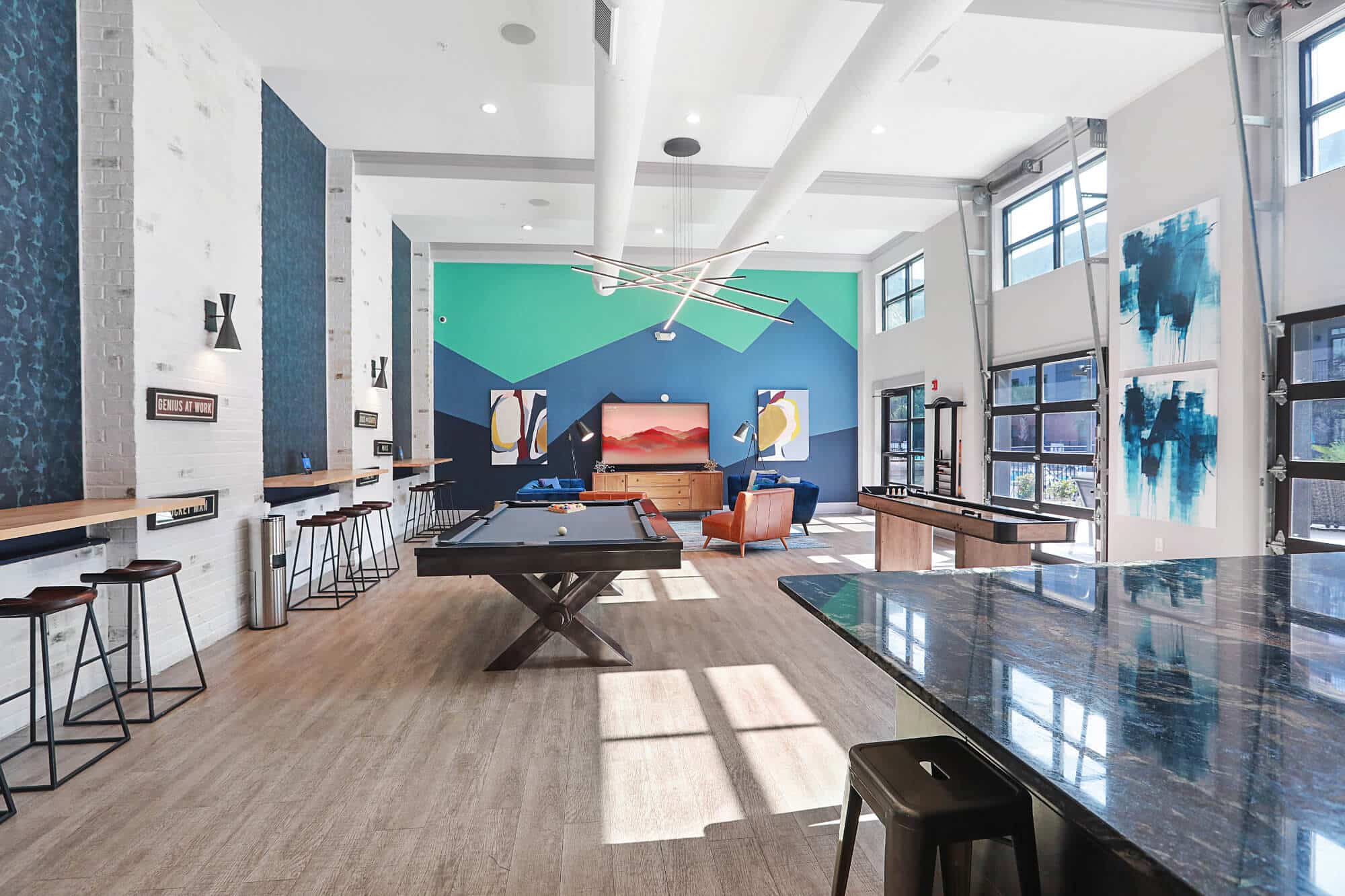 greene crossing off campus apartments near the university of south carolina large clubroom amenity with lounge areas billiard table shuffle board 70 inch tv